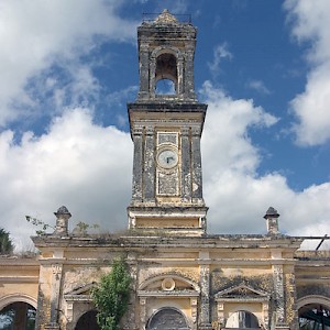 One of the more graceful and haunting haciendas is Uayalceh (pronounced why-al-kay), now abandoned. The clock tower shown here crowns the casa de maquinas. <a href=></a>