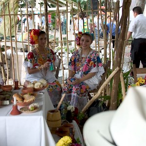 Two lovely ladies wearing the formal version of the traditional Mayan huipile. <a href=></a>