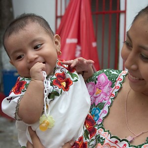 A Mayan baby finally smiles. <a href=></a>